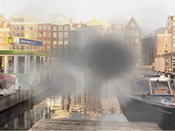 A picture of a canal and boats depicting a representation of what Zac can see as someone with Stargardt Disease a type of macular degeneration, demonstrating that his central vision is affected.